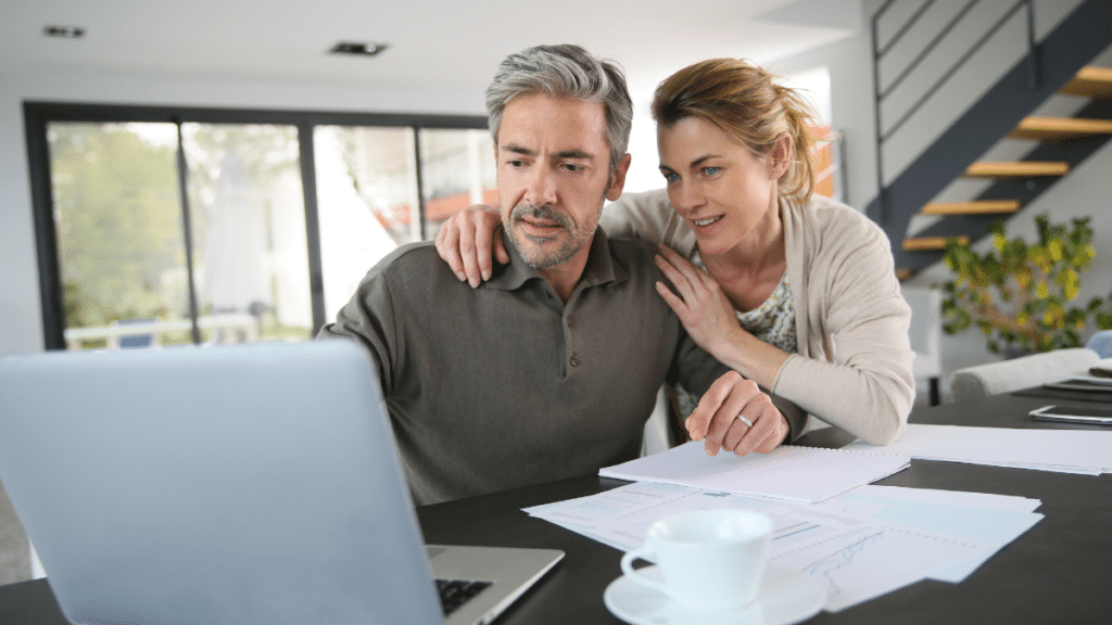 Couple working together on a laptop