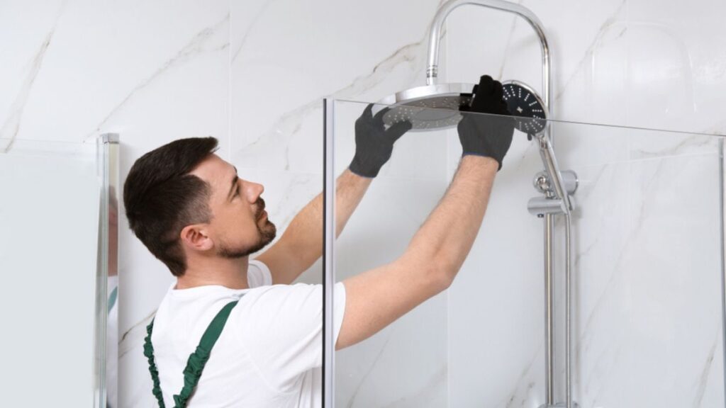 Man installing a shower head