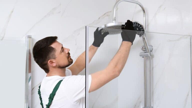 Man installing a shower head