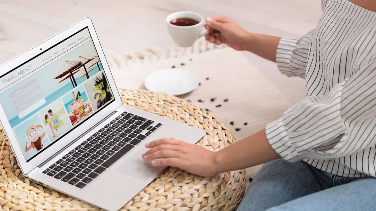 A woman searches for travel deals on her laptop