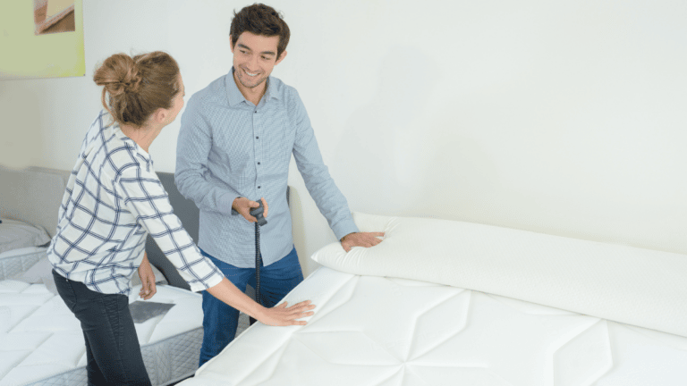 Couple shopping for a new mattress
