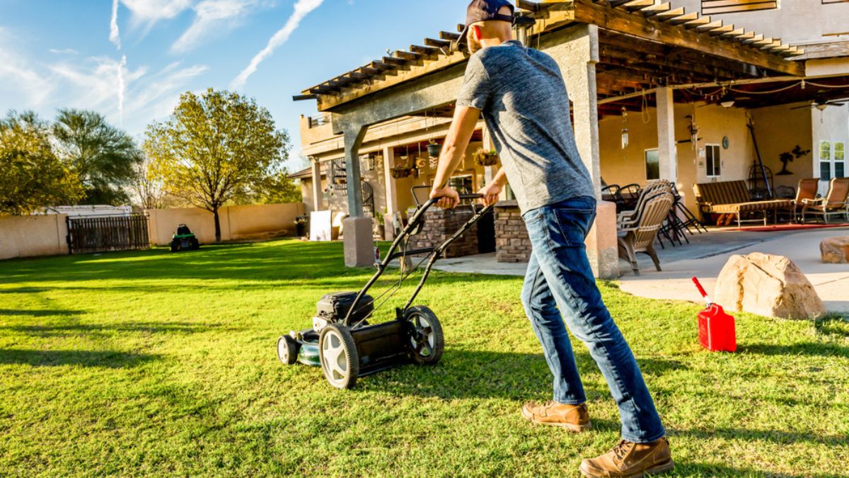 A man mows the lawn