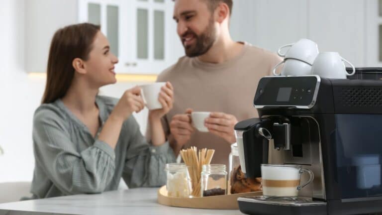 Couple making and enjoying a cup of coffee at home