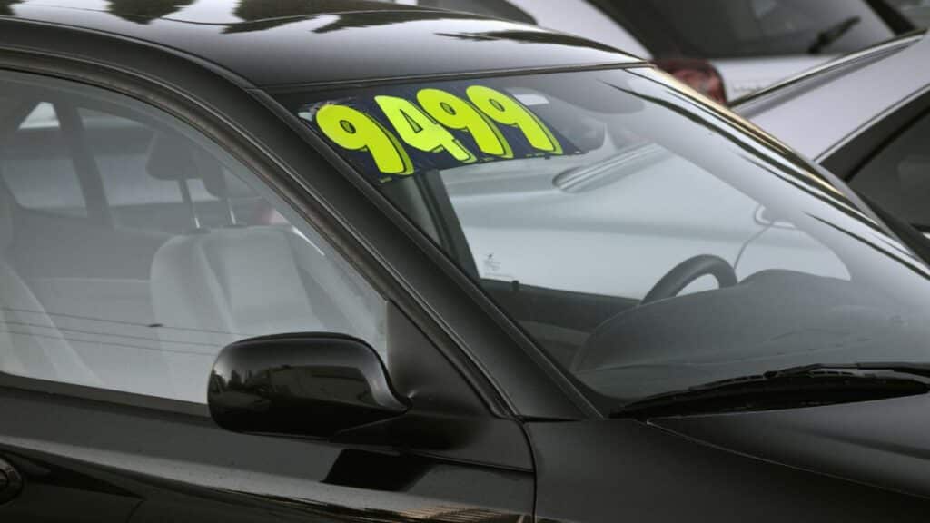 Used car with a price sticker on it