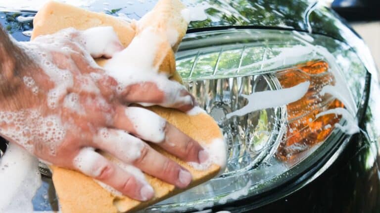 Man washing a car by hand