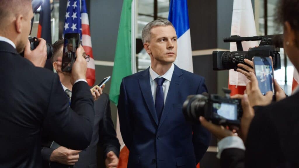 Politician speaking with reporters