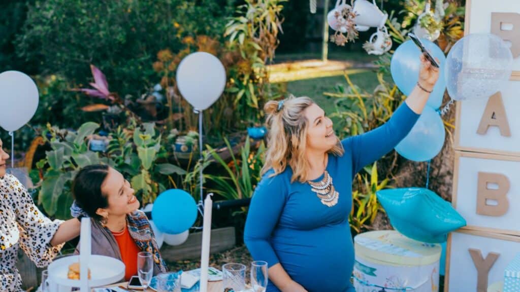 Woman taking a selfie at her baby shower