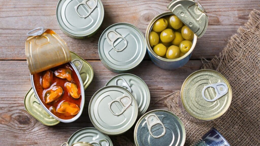 Multiple cans of food sitting on a counter