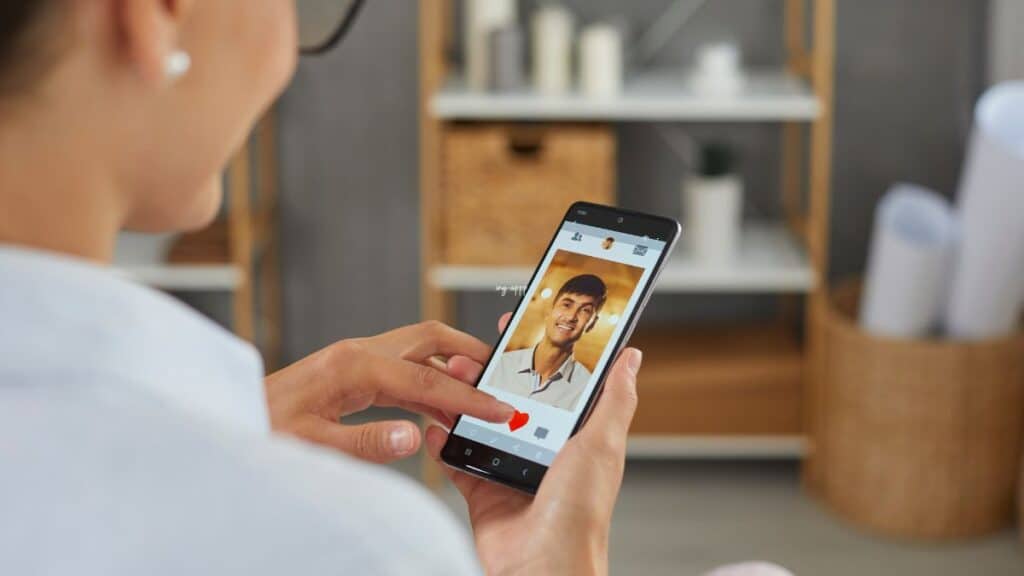 Woman scrolling a dating app on her phone