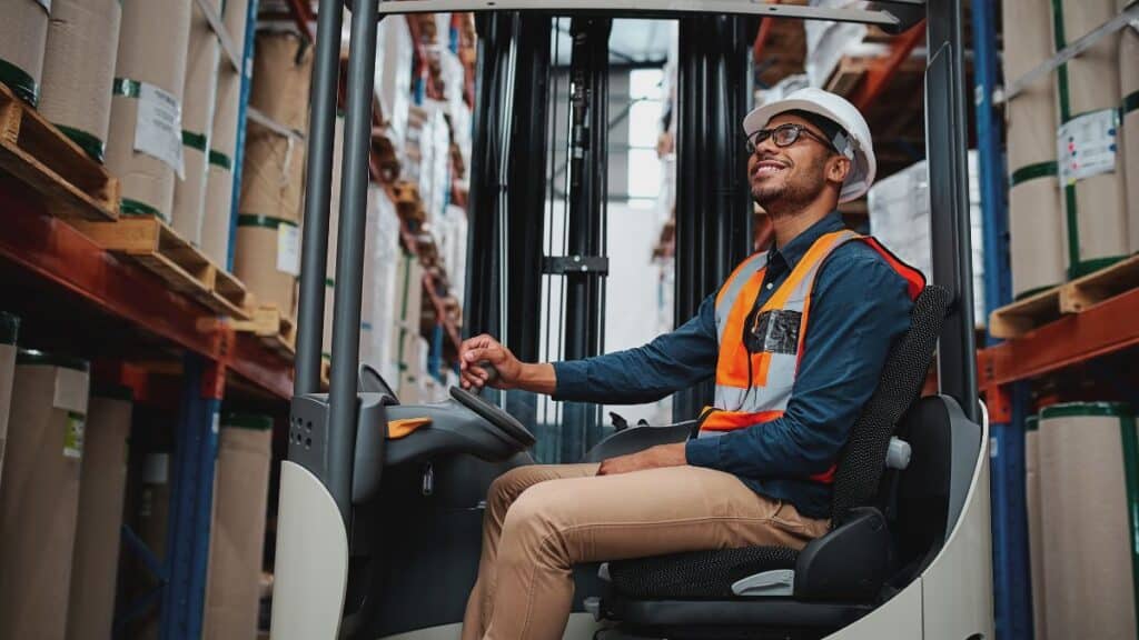 Man driving a forklift in a warehouse