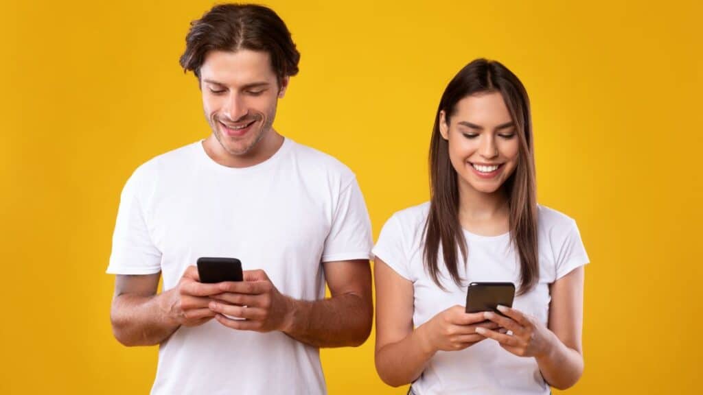 Couple playing games on their phones