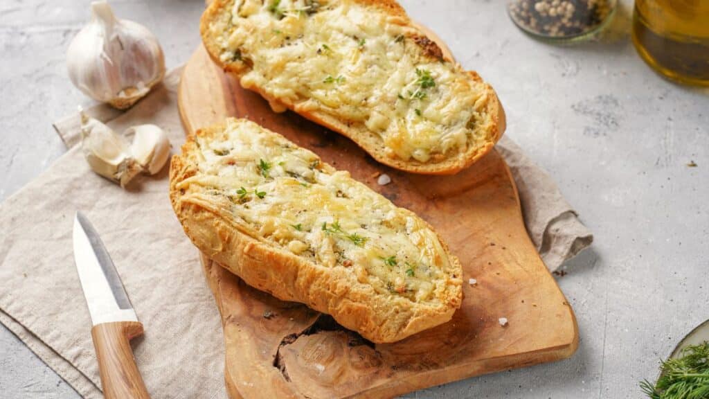 Garlic bread on a cutting board