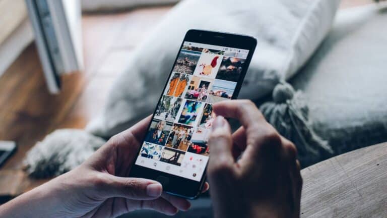 Someone scrolling Instagram on their phone