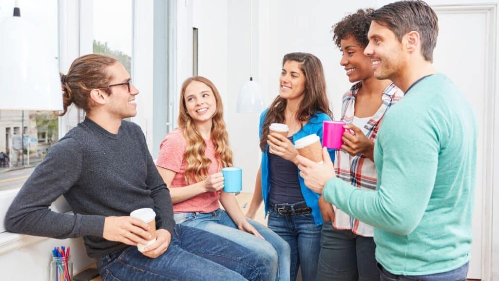 Group of young adults sitting around talking