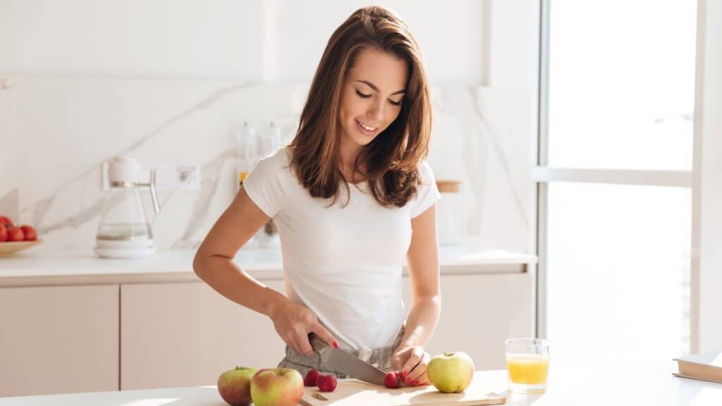 Woman preparing breakfast in kitchen