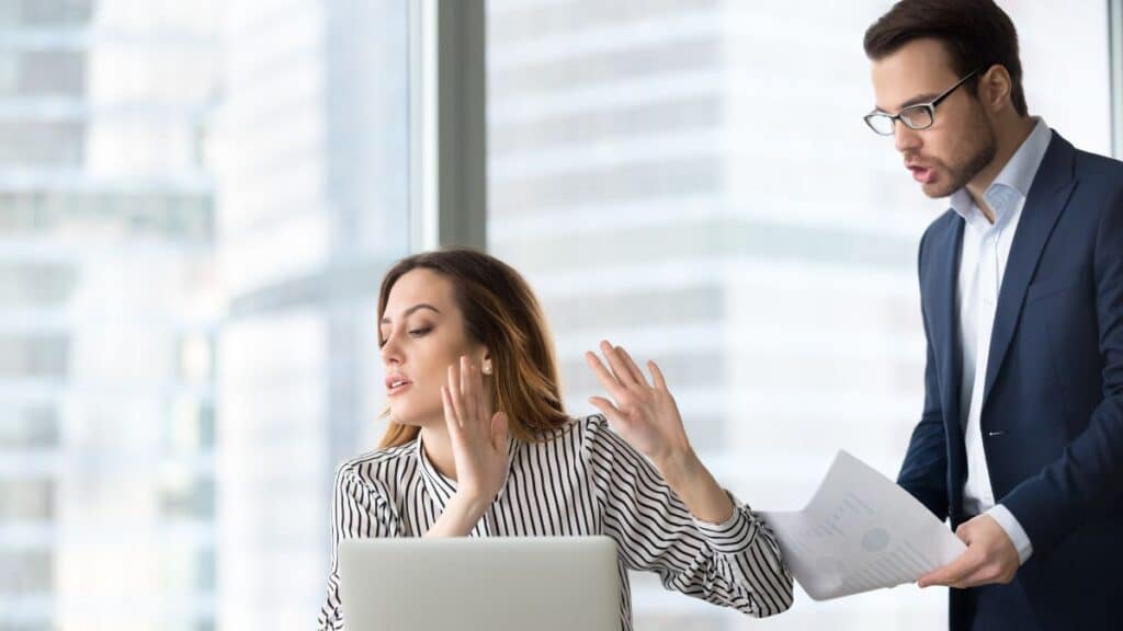 Man annoying female coworker