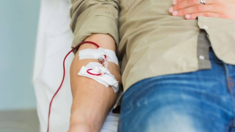 Person sitting in a chair donating blood