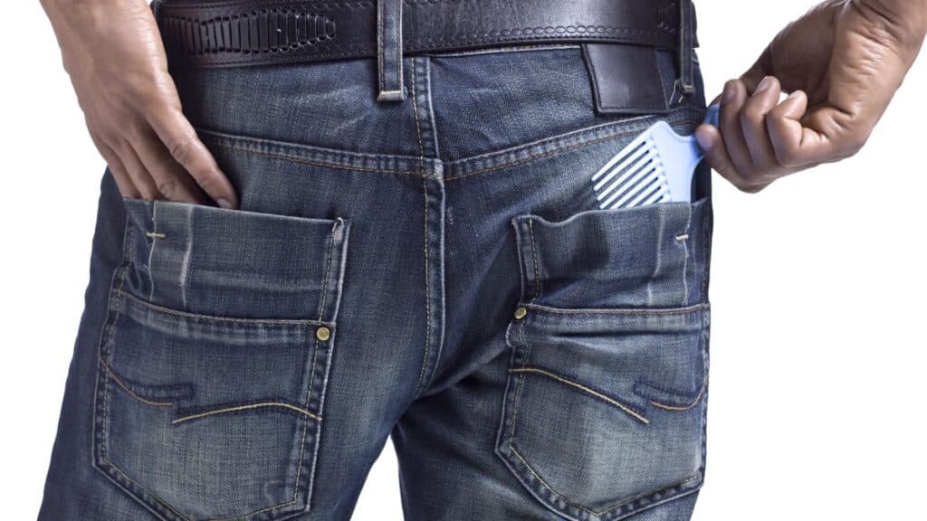 Man putting pick in his back pocket