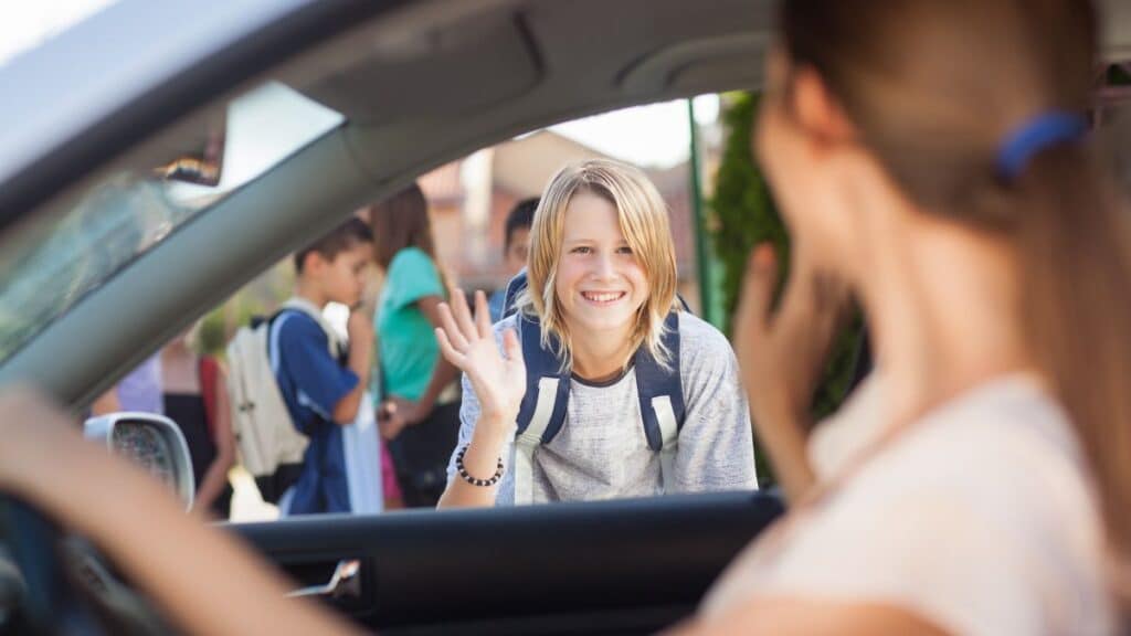 Mom dropping child off a school