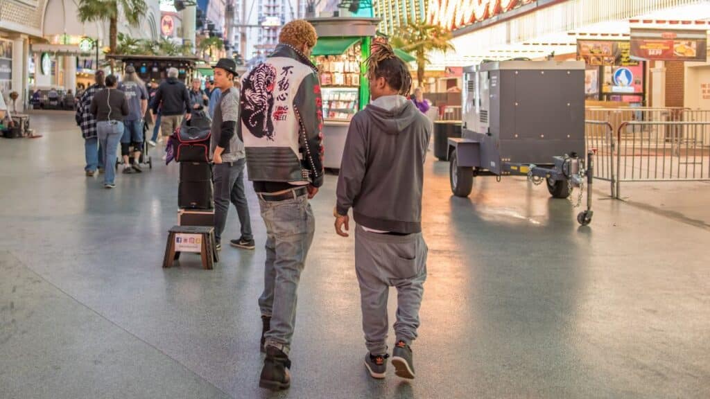Teens walking down the street with pants sagging
