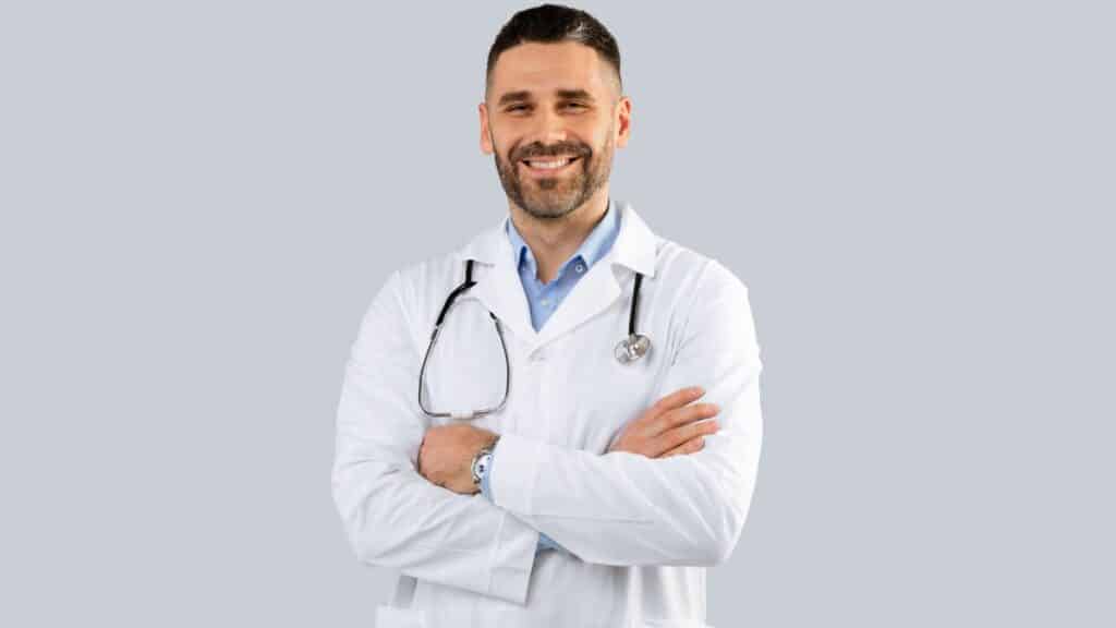 Handsome doctor folding his arms