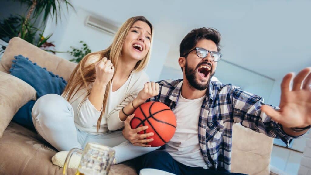 Couple watching sports together