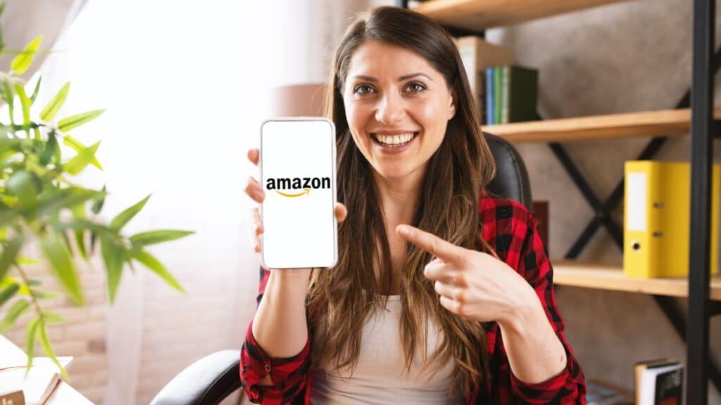 Woman showing her smartphone with Amazon opened on the screen