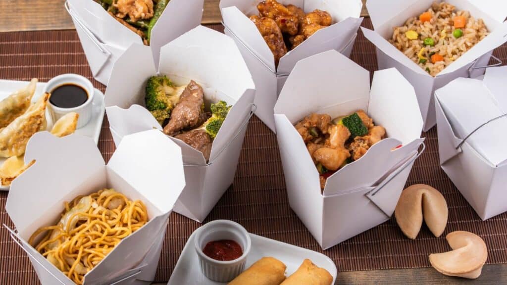 Table filled with Chinese takeout containers