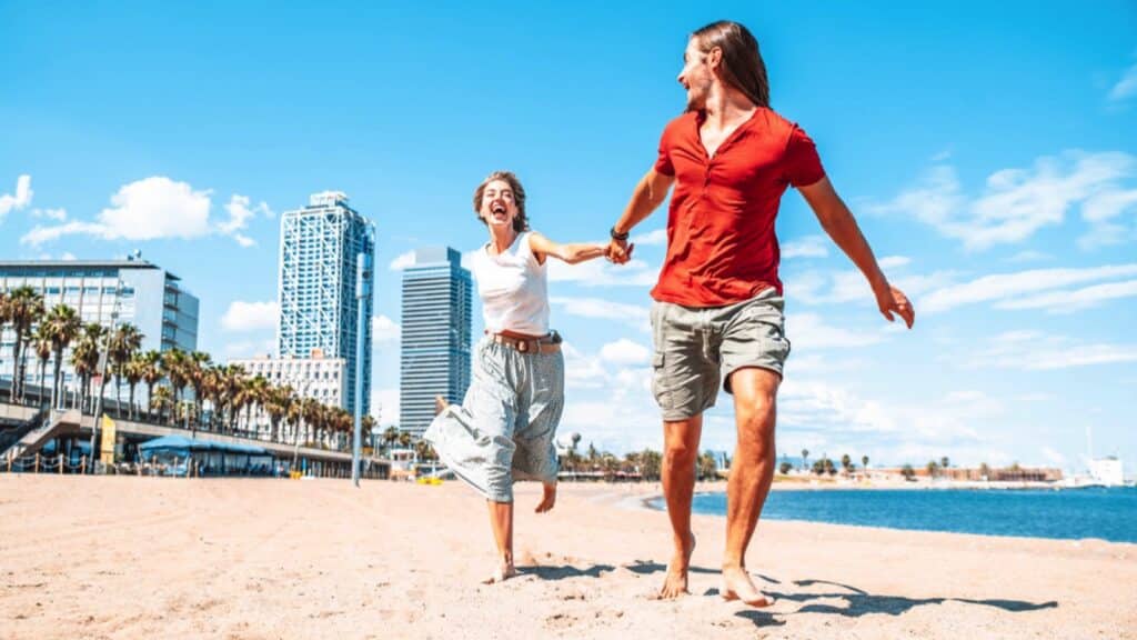 Couples in beach, Spain
