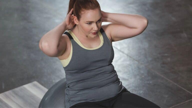 Woman doing crunches on an exercise ball