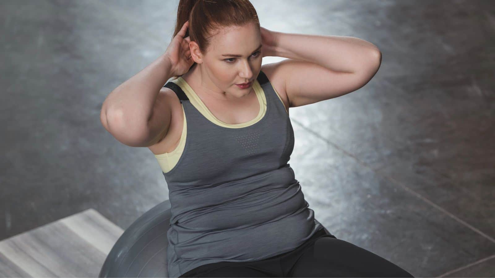 Woman doing crunches on an exercise ball