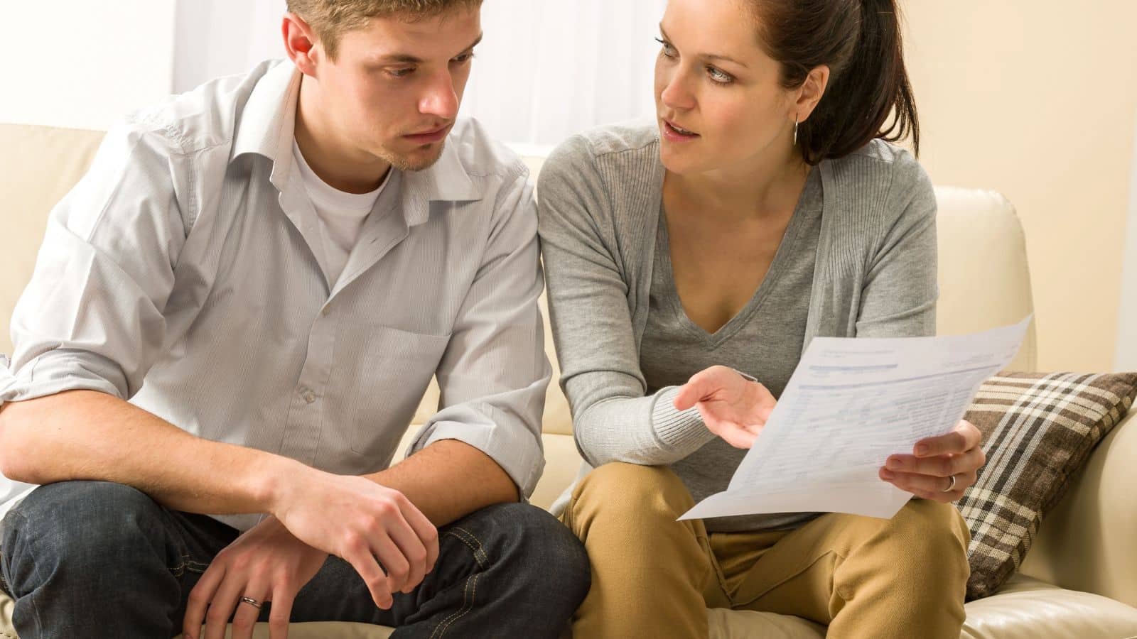Couple sitting together and talking about finances