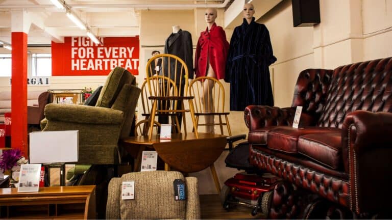 Used furniture piled up in a thrift shop