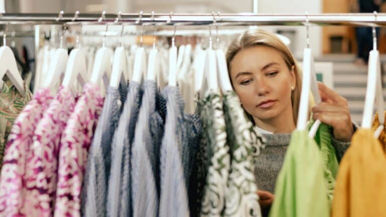 Woman looking through a rack of clothing