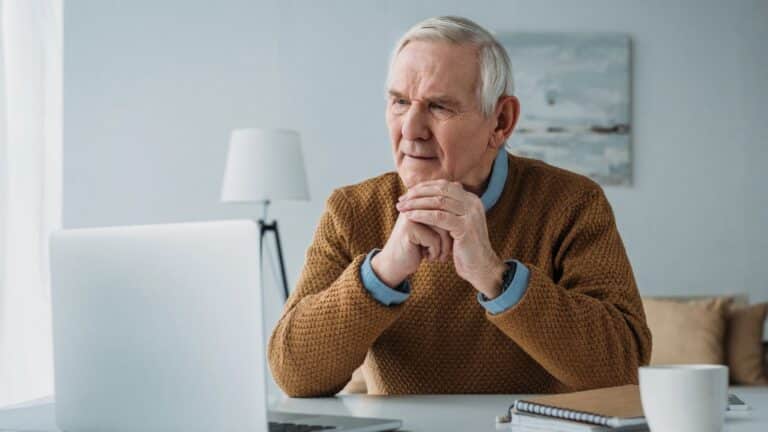 Retired man working on his laptop