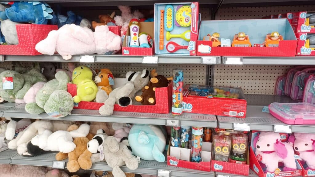 Toys and stuffed animals on a store shelf