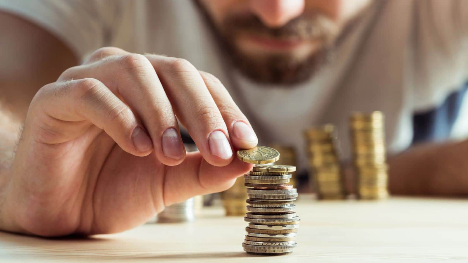 Man stacking up coins