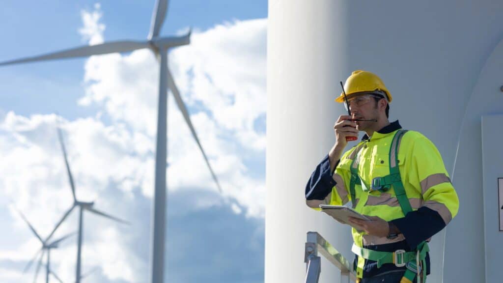 Wind turbine technician talking on the phone