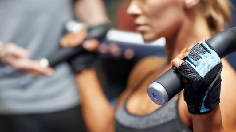 Woman in gym lifting weights