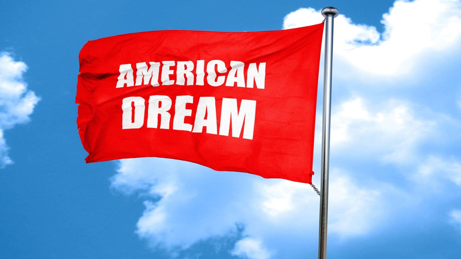 Red flag that says "American Dream" flying in a blue sky