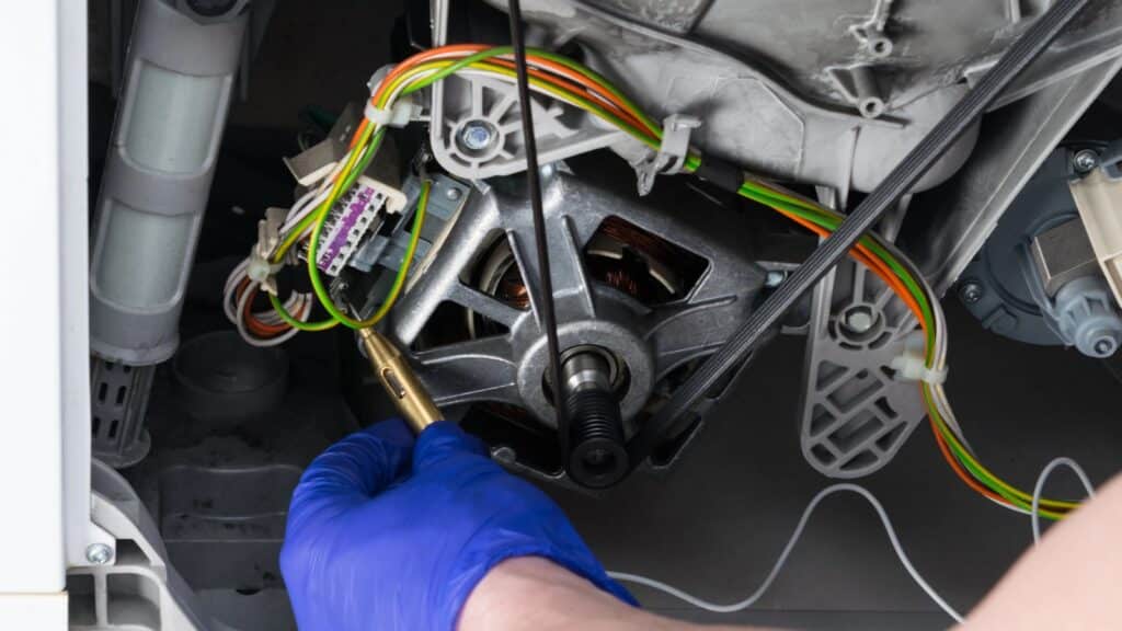 Person repairing a broken appliance