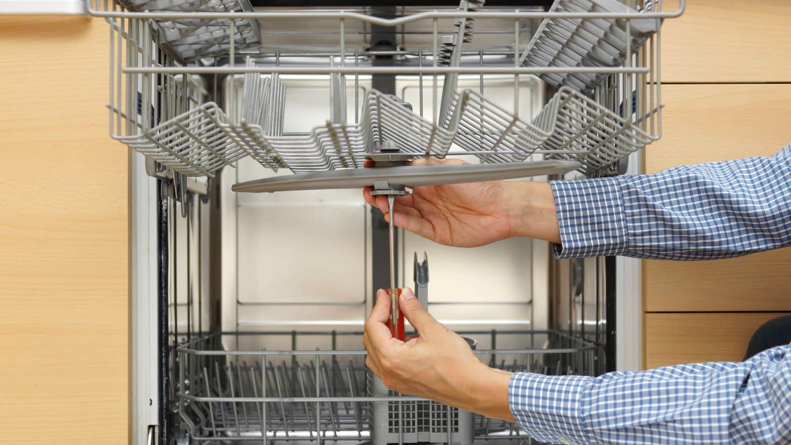 Man fixing dishwasher