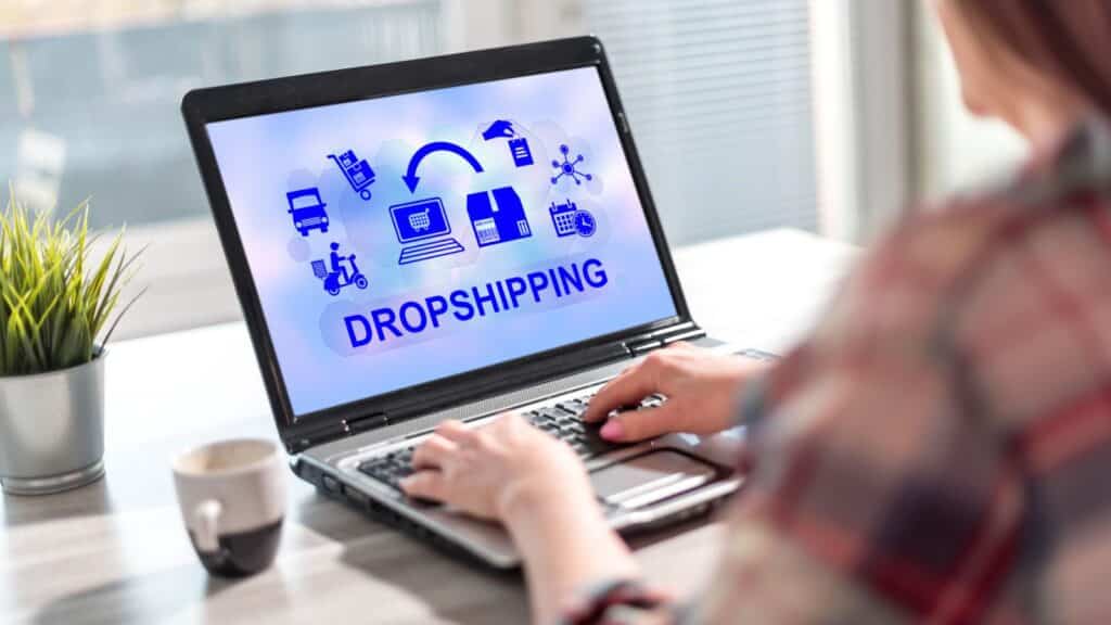 Woman working on dropshipping on her laptop