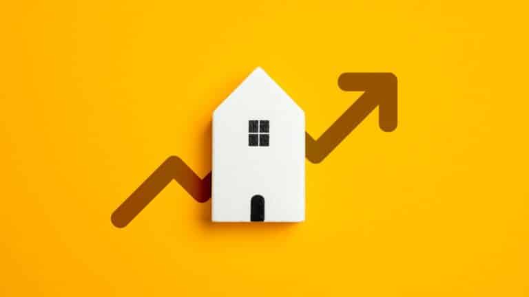 Image of a white house on a yellow background with an arrow through it