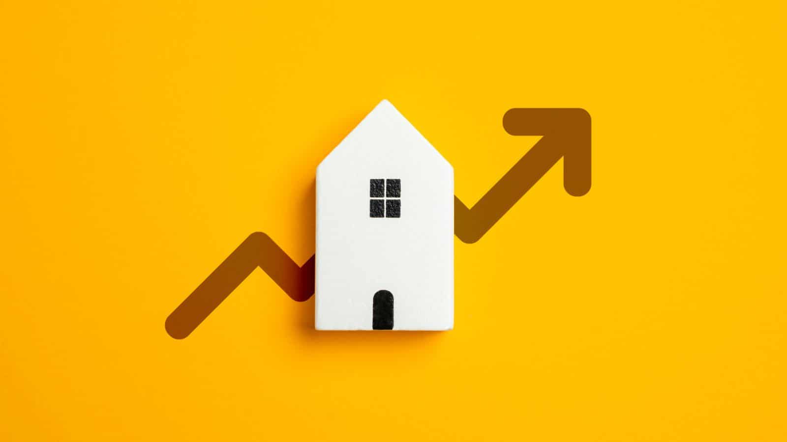 Image of a white house on a yellow background with an arrow through it