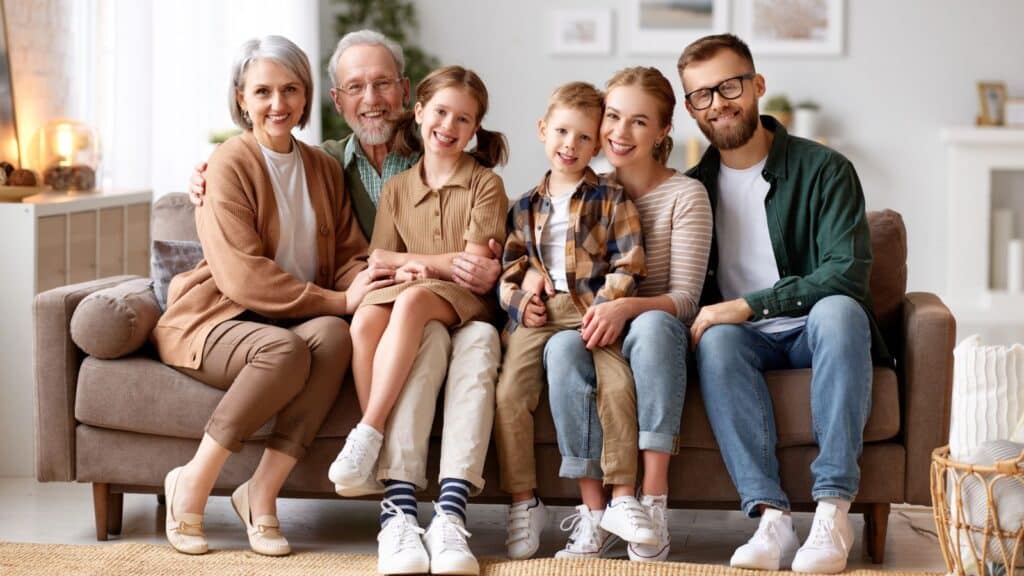 Multigenerational family sitting together on the couch