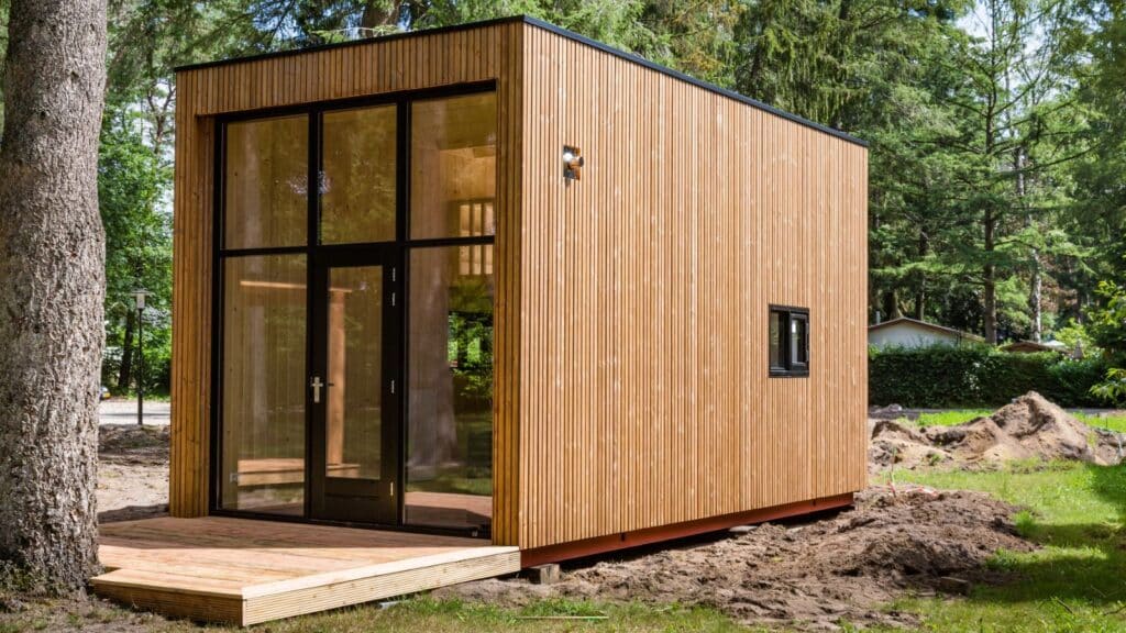 Tiny modern wooden house in the forest