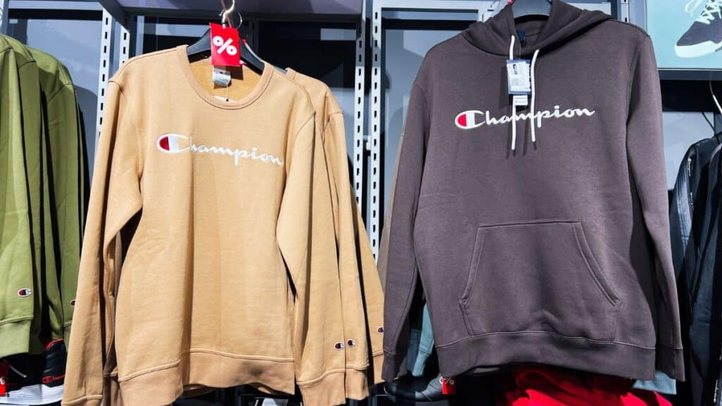 Champion sweatshirts hanging in a store
