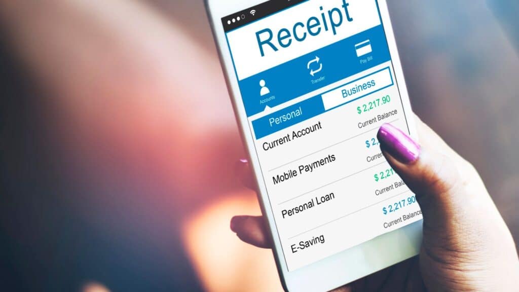 Person holding phone looking at a digital receipt