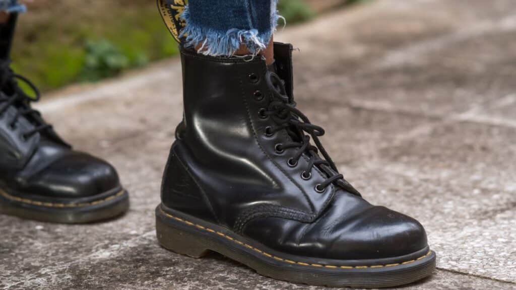 Person wearing black Dr. Martens combat boots